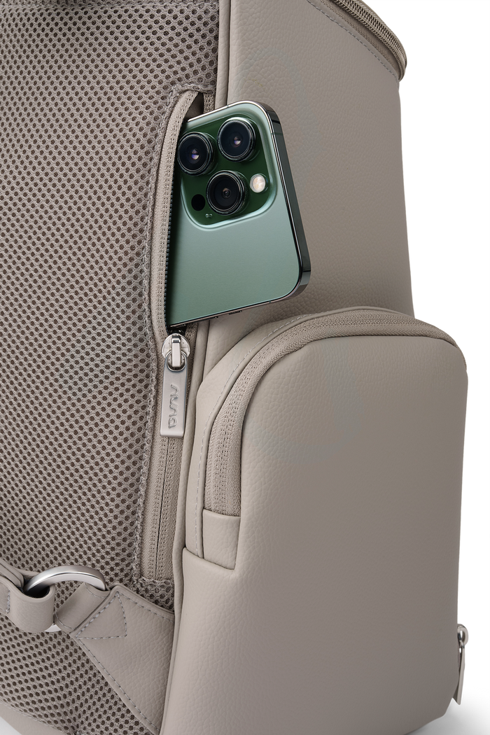 [Taupe] Green smartphone in a pocket of a beige backpack on a white background