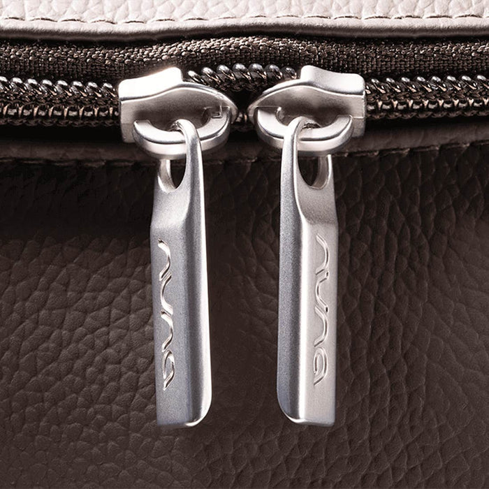 [Espresso] Close-up of a zipper pull on a textured surface