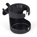 Close-up view of a black plastic cup holder attached to a stroller frame.