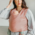 Woman wearing baby in Seasonal Solly Baby Wrap - Rose Quartz
